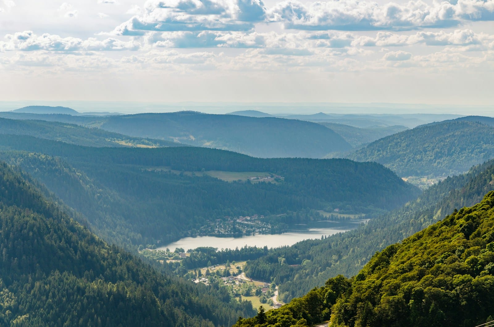green mountains under white clouds during daytime