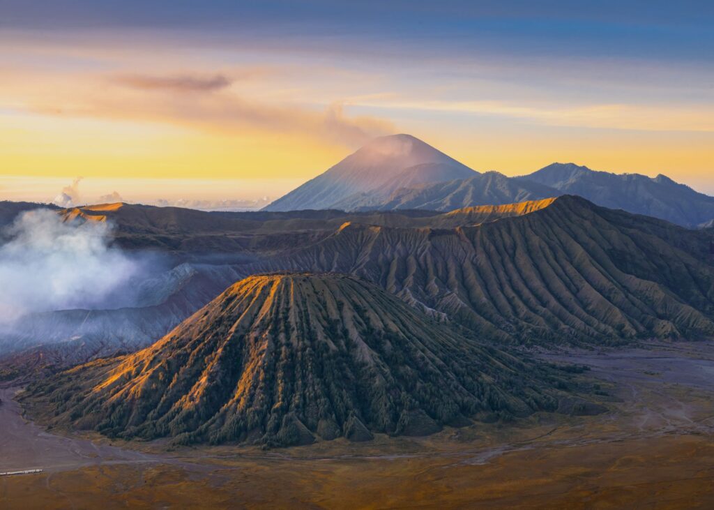Breathtaking view of Mount Bromo at sunrise showcasing volcanic landscape in Indonesia.