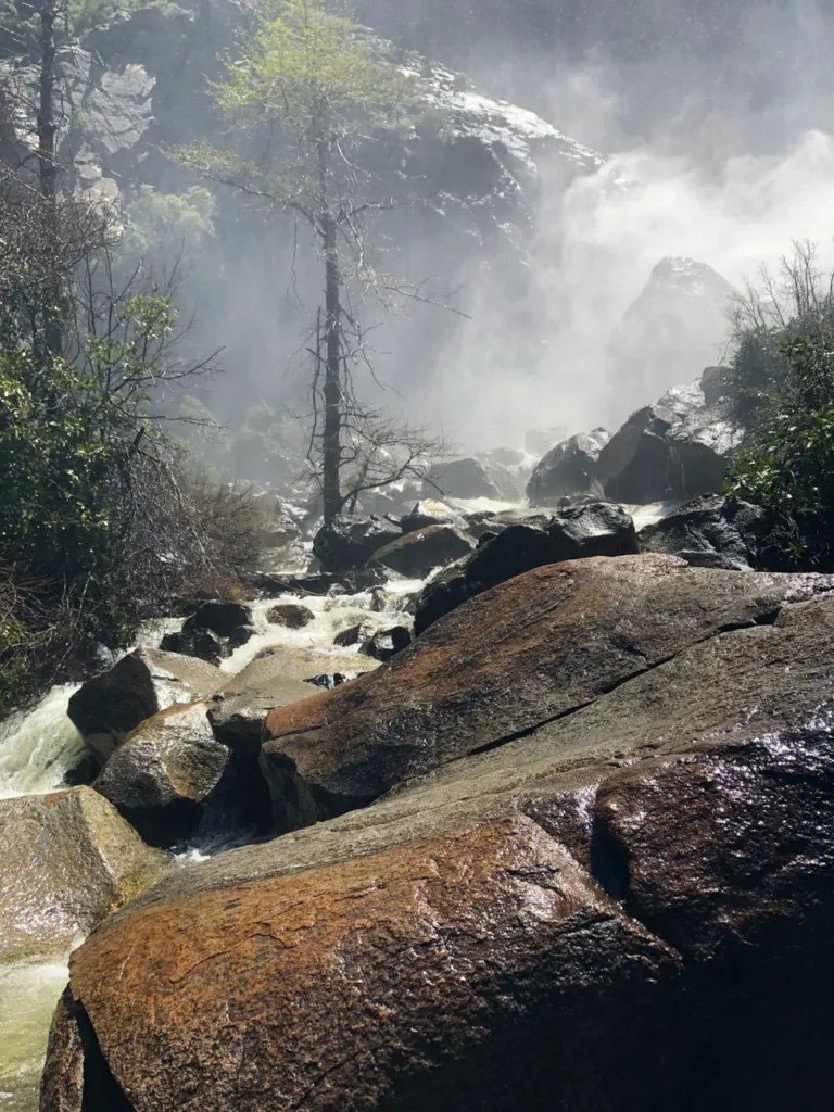 Captivating waterfall rocks and mist in Yosemite National Park, California.