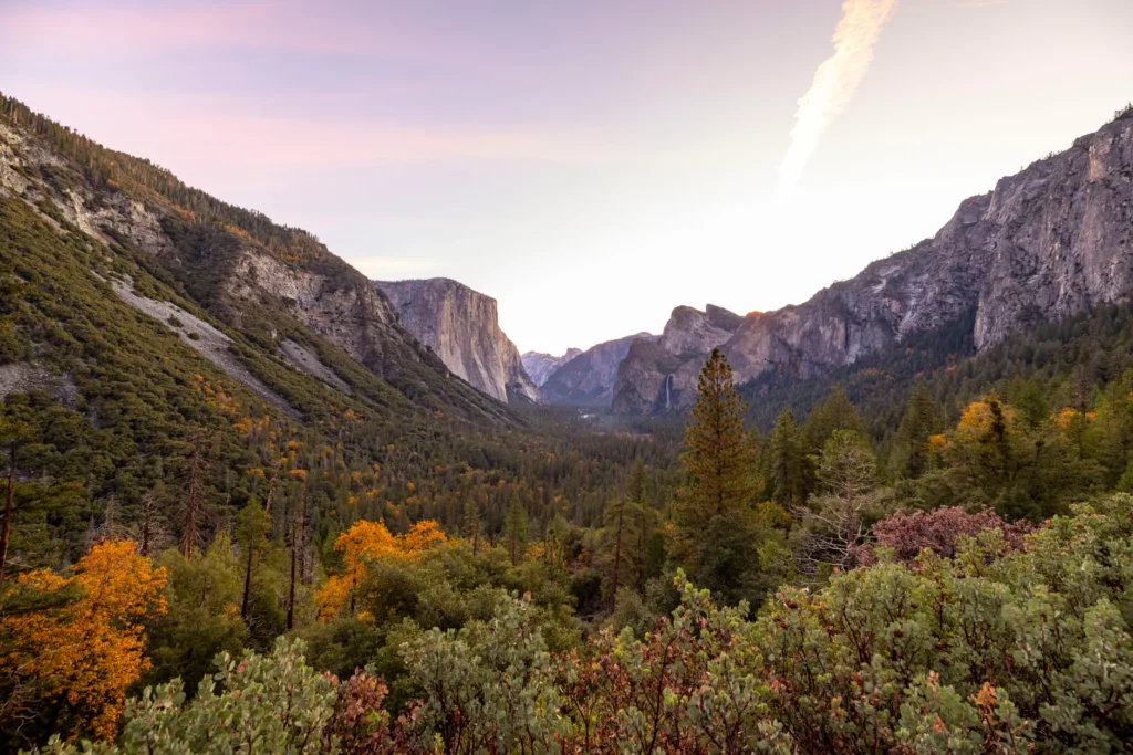 Capture of Yosemite Valley during twilight with fall colors and iconic landscape features.