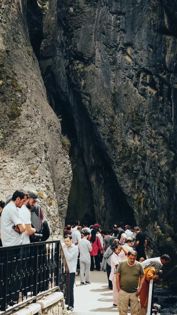Crowds of tourists exploring a breathtaking canyon in Turkey, capturing the essence of adventure and travel.
