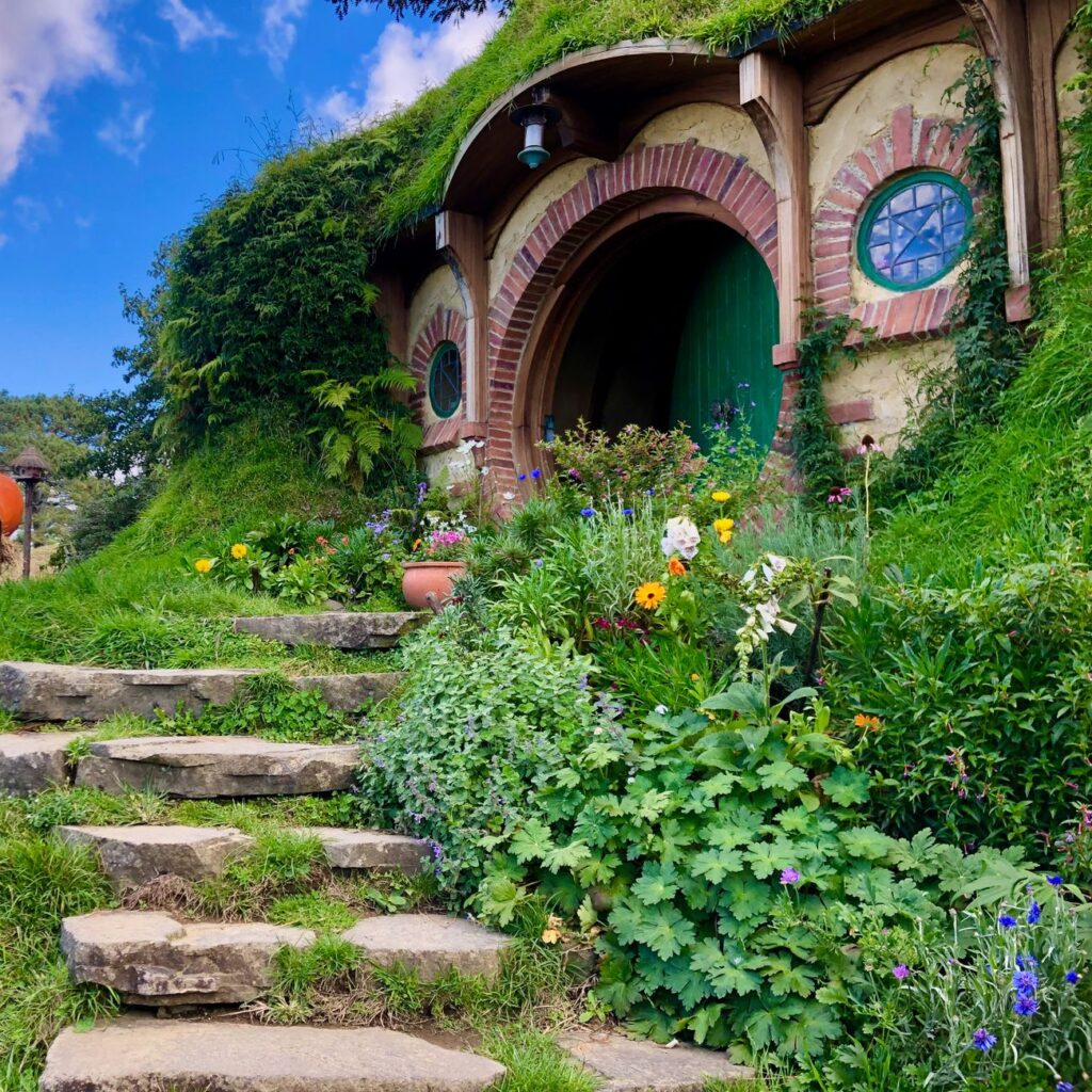 Enchanting hobbit house with lush garden in Hobbiton, Matamata, perfect for fantasy lovers.