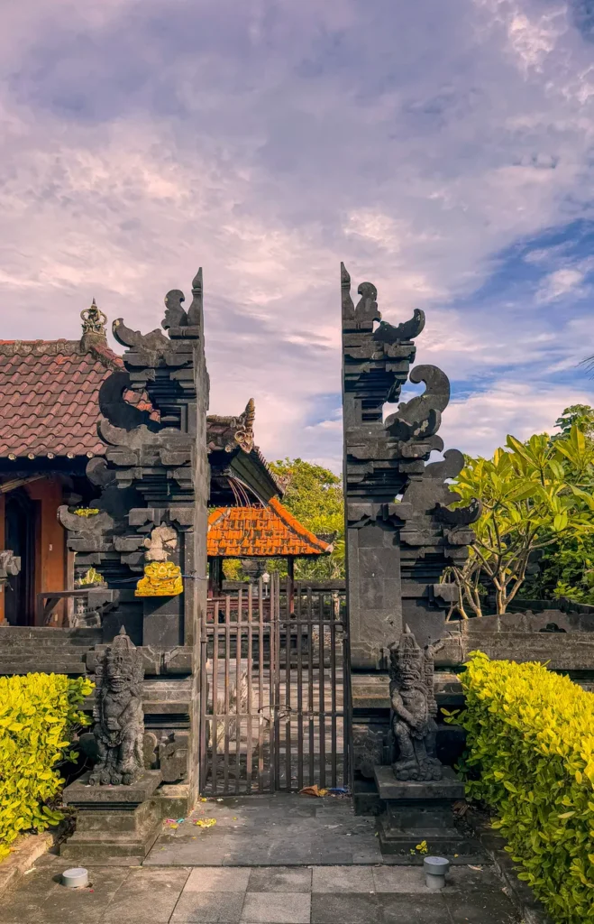 Explore the intricate architecture of a Balinese temple gate, highlighting its cultural significance and stunning design.