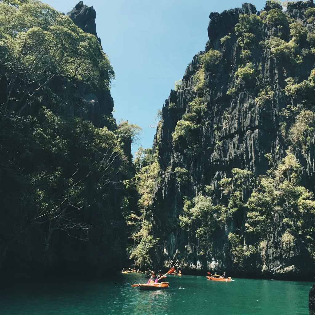Explore the stunning limestone cliffs and turquoise waters of El Nido, Philippines, perfect for kayaking adventures.