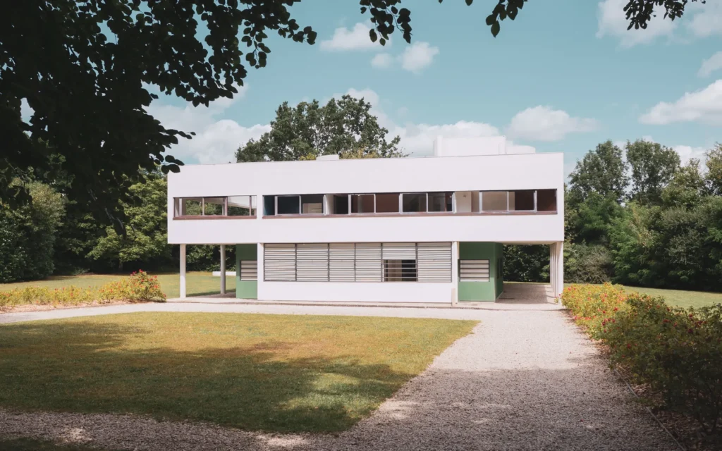 Modernist architecture villa surrounded by greenery in Paris, France.