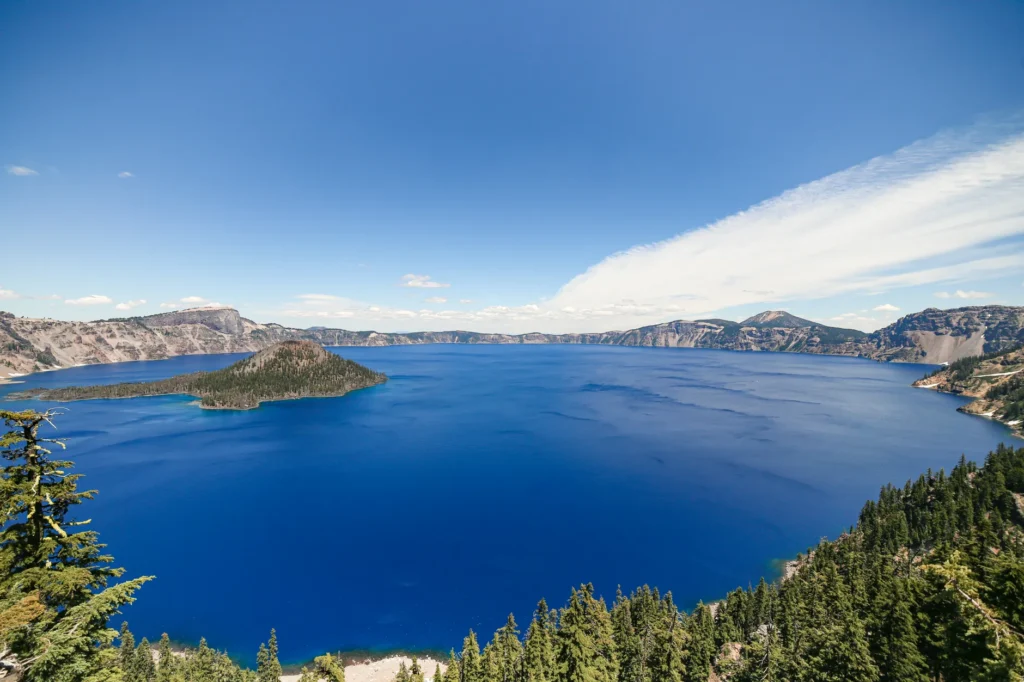 Stunning panoramic view of Crater Lake under a clear blue sky in Oregon.