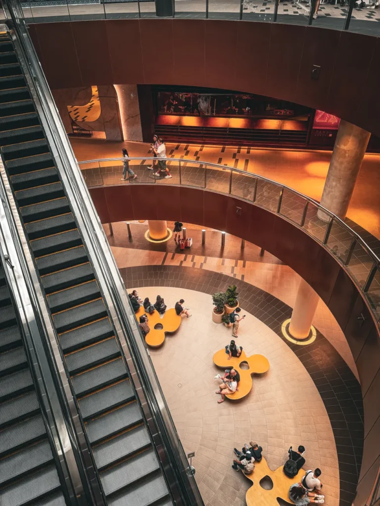 Stylish interior view of a shopping mall in Malaysia with unique architecture and vibrant atmosphere.