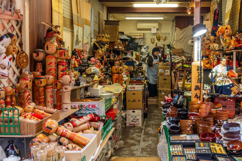 Vibrant and cluttered interior of a traditional Japanese antique shop filled with various cultural items and souvenirs.