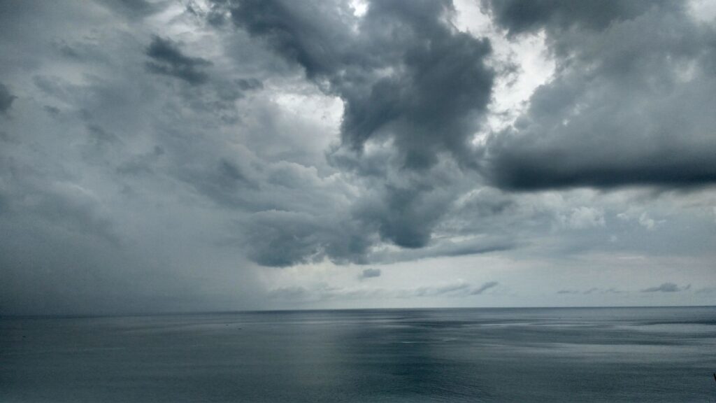 A dramatic view of storm clouds over the sea in North Sumatra, Indonesia.