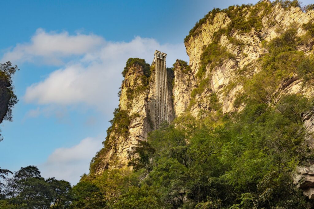 Bailong Elevator amid dramatic cliffs in Zhangjiajie Forest Park, China.