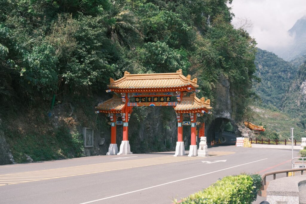 Beautiful torii gate at the entrance of Taroko Gorge in Taiwan, surrounded by lush greenery.