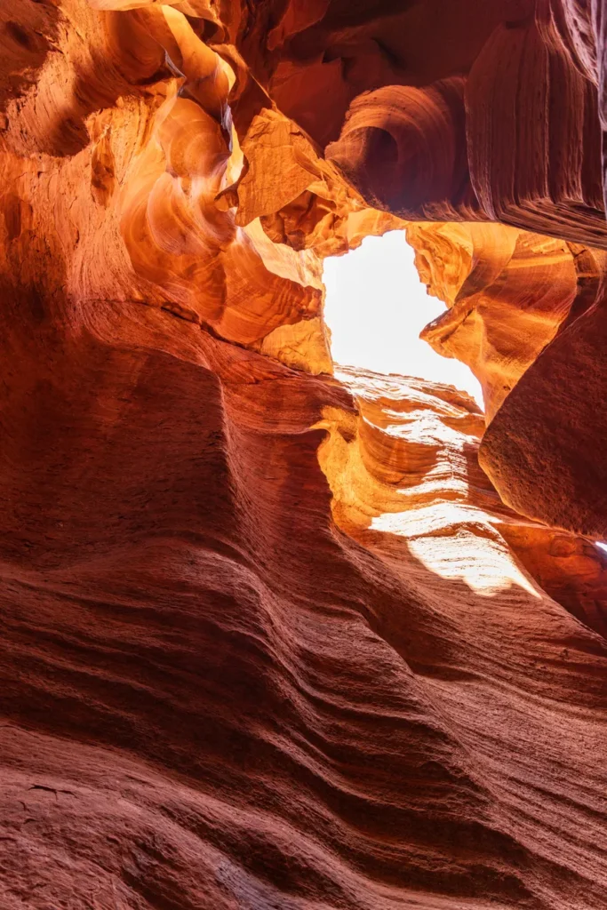 Breathtaking view of Antelope Canyon's natural sandstone formations in Arizona, showcasing vivid red and orange tones.