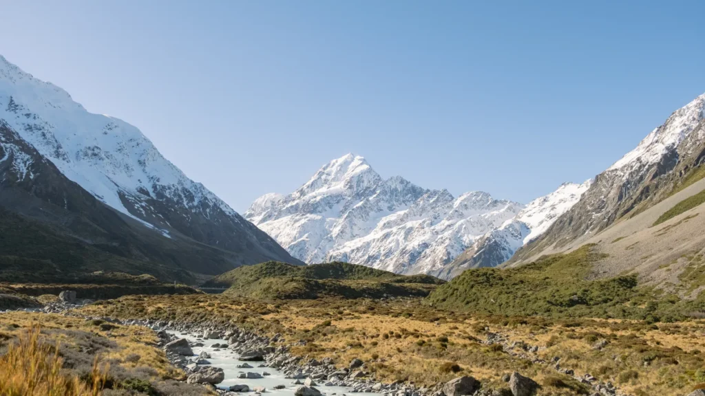Breathtaking view of snow-capped mountains along Hooker Valley, New Zealand.