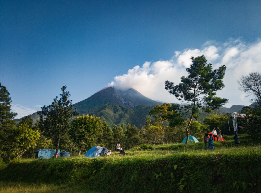 Campers enjoy a serene day near Mount Merapi in Yogyakarta, Indonesia.