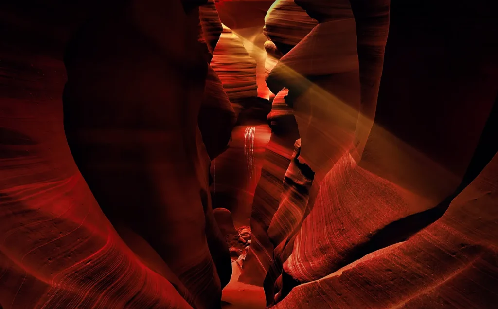 Captivating sunbeams illuminate the red sandstone in Arizona's Antelope Canyon.