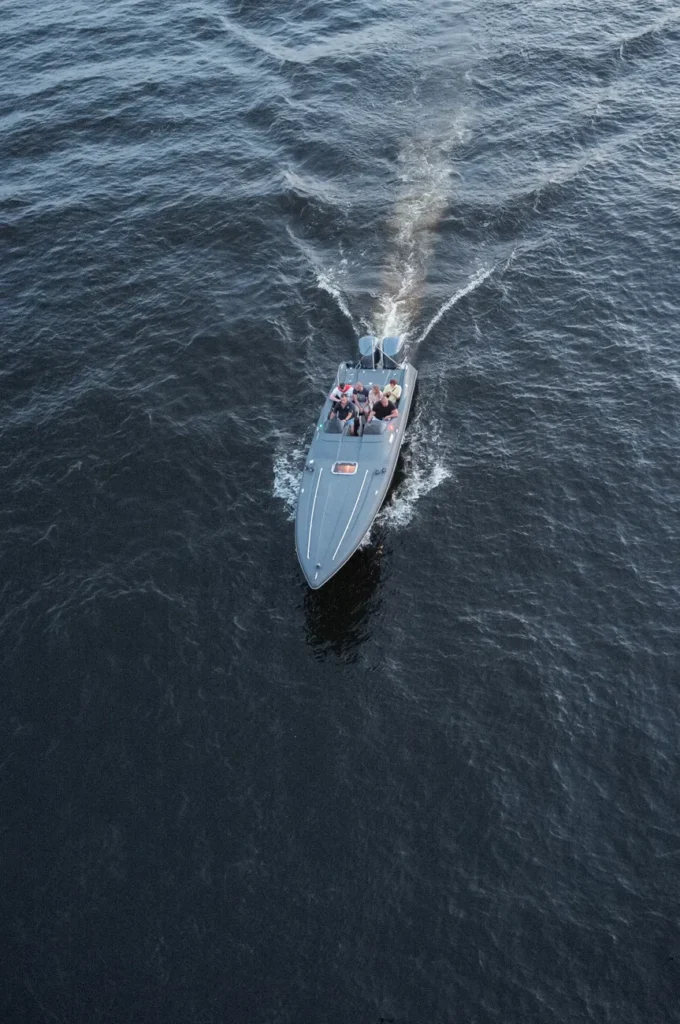 Drone captures a speedboat with people on the Neva River in Saint Petersburg, Russia.