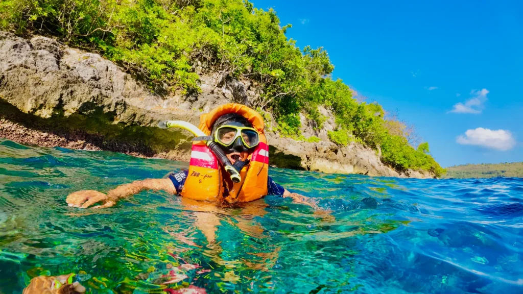 Explore snorkeling in Bali with vibrant coral reefs and crystal clear waters.