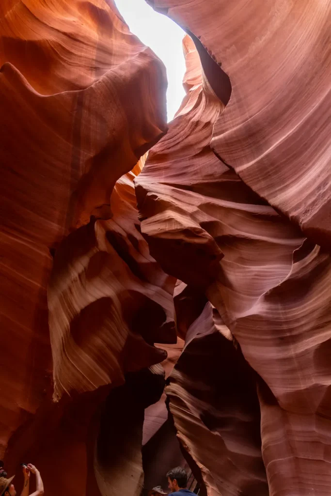 Explore the breathtaking orange and red rock formations in Arizona's iconic Antelope Canyon.