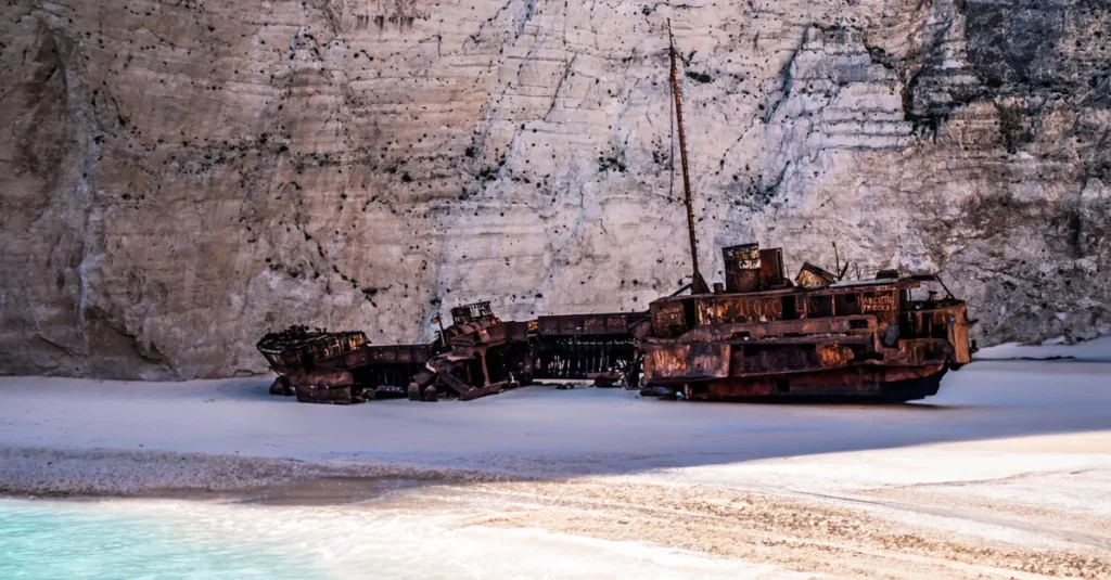 Explore the iconic shipwreck on Navagio Beach, Zakynthos, Greece, surrounded by dramatic cliffs and turquoise waters.