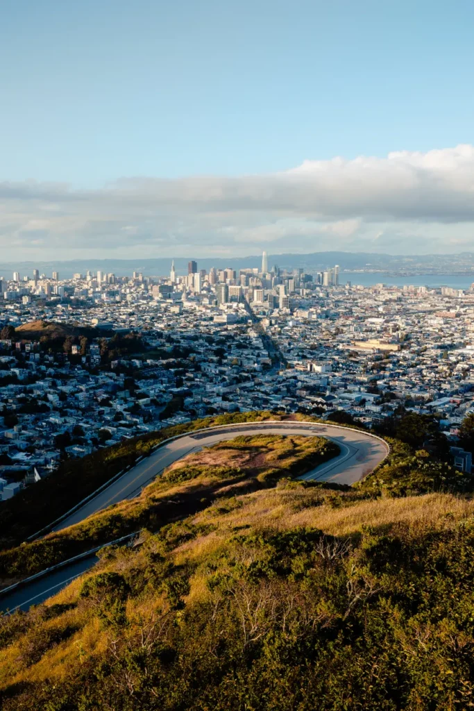Explore the winding roads and cityscape of San Francisco from Twin Peaks.