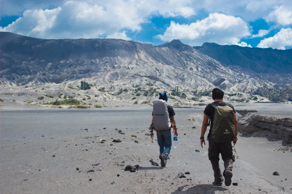 Hikers exploring the stunning landscape near Mount Bromo in East Java, Indonesia.