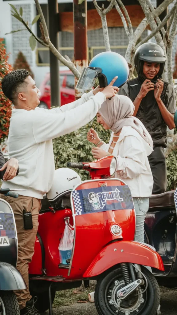 Lively gathering of young adults with scooters in East Java, showcasing vibrant community spirit and fun.