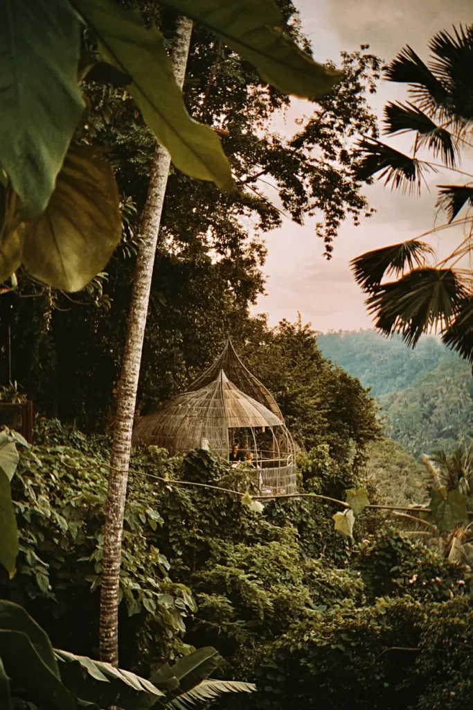Serene jungle hut nestled in lush greenery showcasing the beauty of Ubud, Bali's natural landscape.