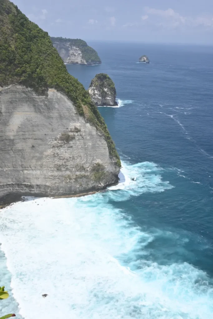 Stunning cliffs and azure ocean waves at Nusa Penida, Indonesia.