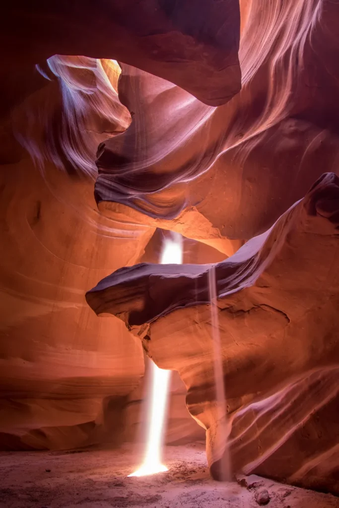 Stunning sunrays illuminate the sandstone walls of Upper Antelope Canyon, Arizona.