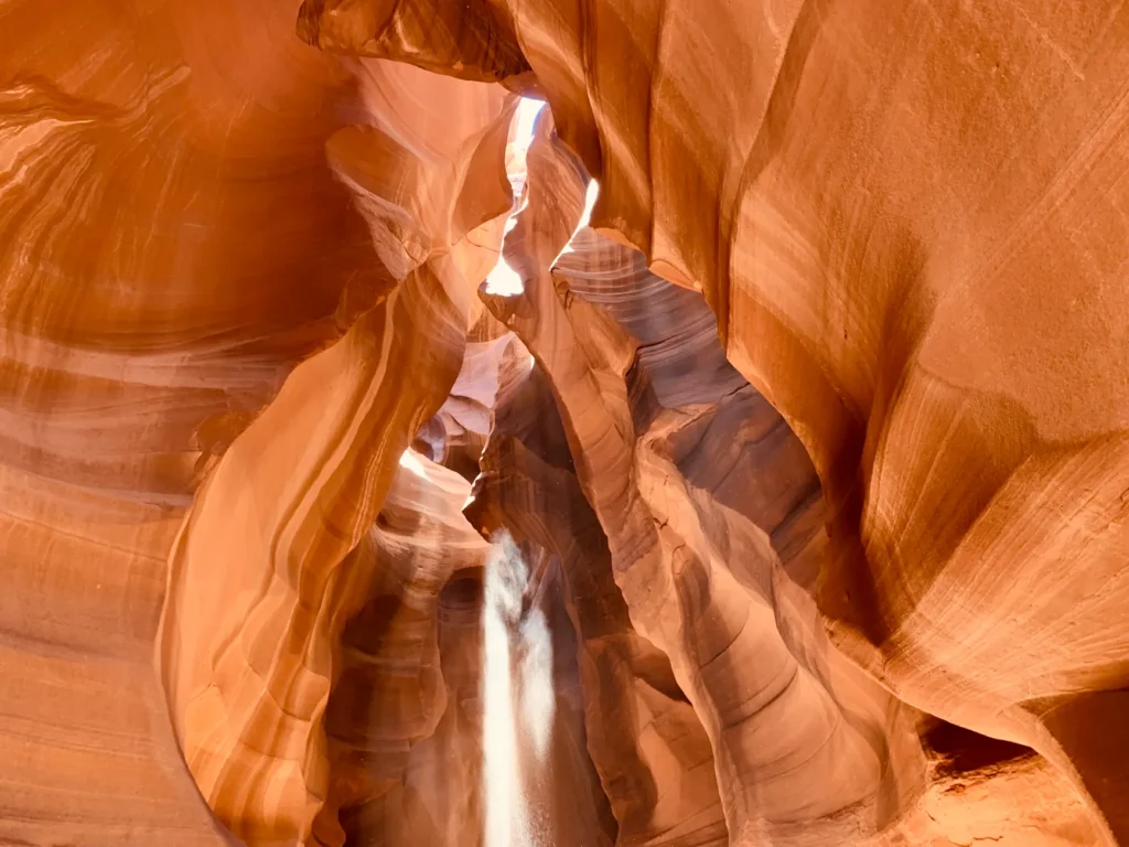 Stunning view of Antelope Canyon with sunlight filtering through sandstone formations.