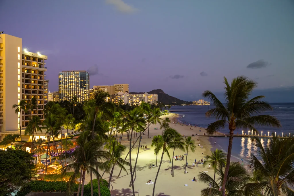 Twilight view of Waikiki Beach in Honolulu with Diamond Head in the background.